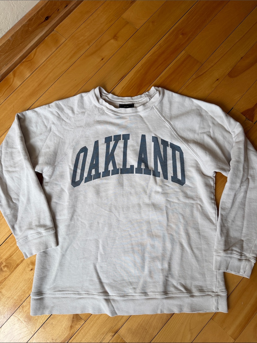 Original Retro Brand White Oakland Crewneck Sweatshirt with Blue Lettering